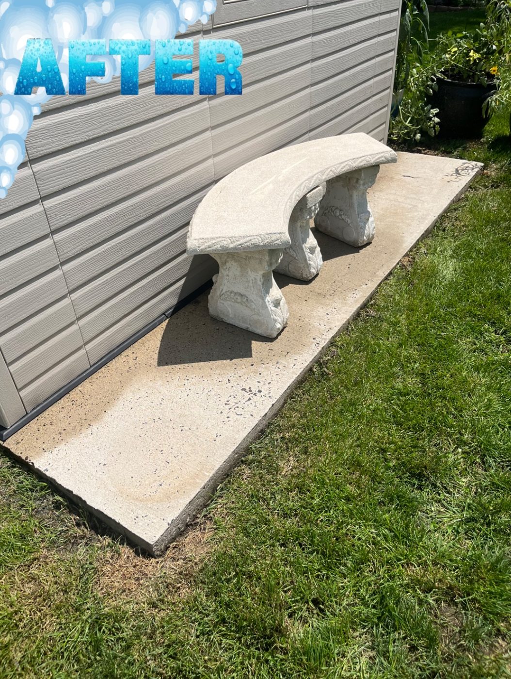 The same concrete pad and stone bench after pressure washing